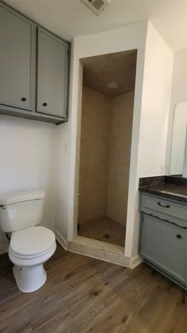 a bathroom with a toilet and a sink