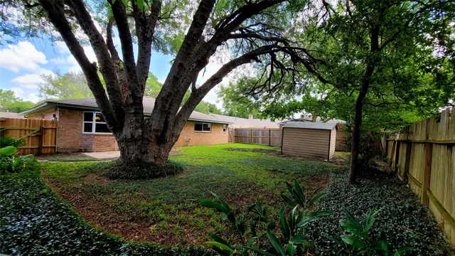 a tree in a garden of a house