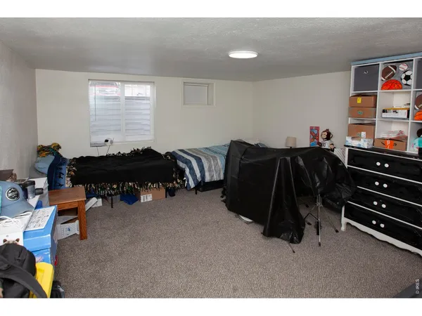 a bed room with furniture and a window