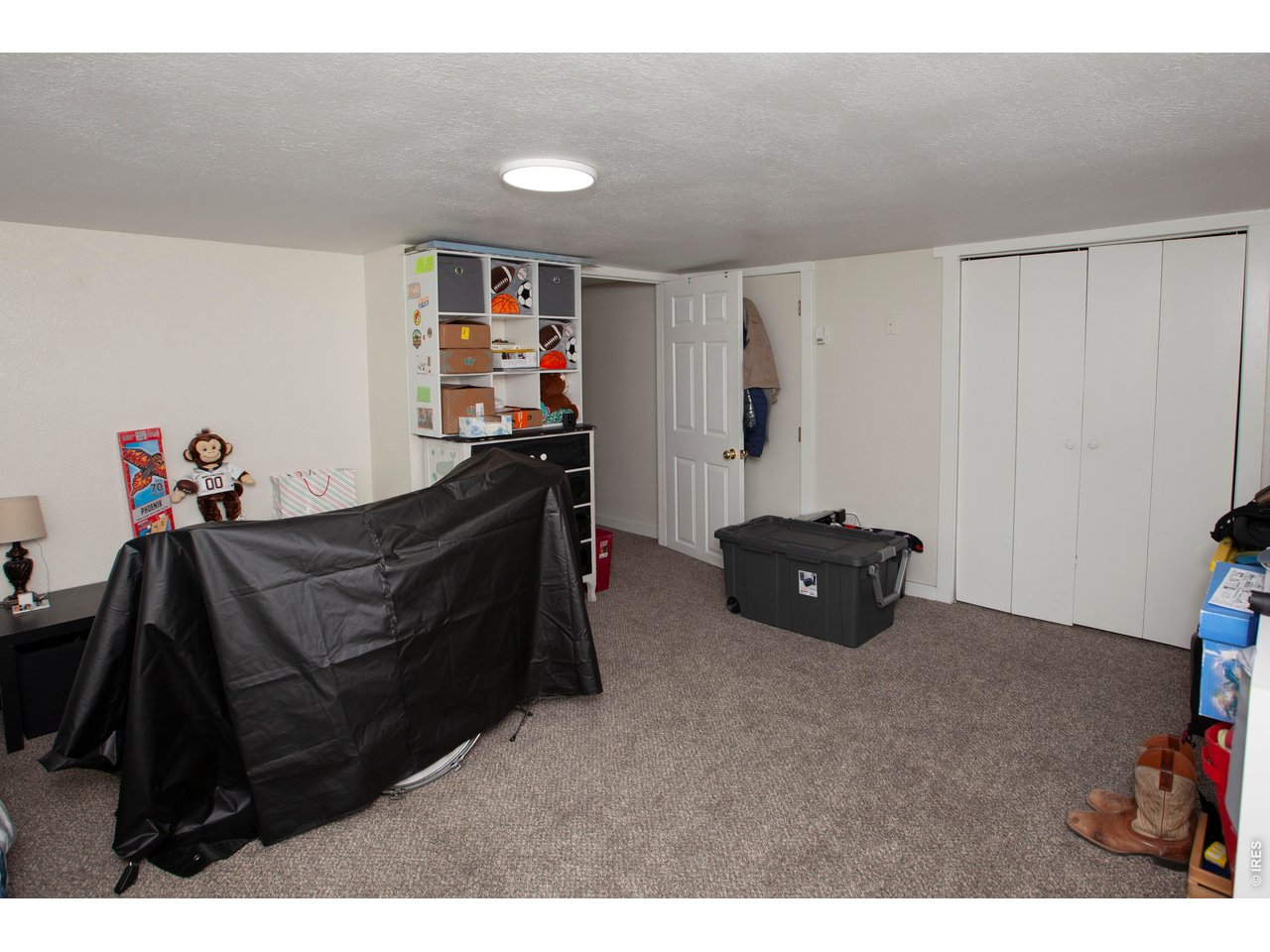 212 Denver Street Sterling, CO 80751 - Photo 23 of 30 a living room with furniture and a window