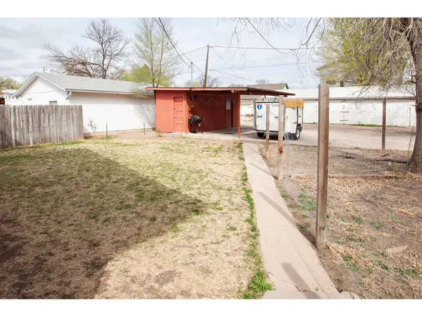 a view of house with outdoor space and sitting area