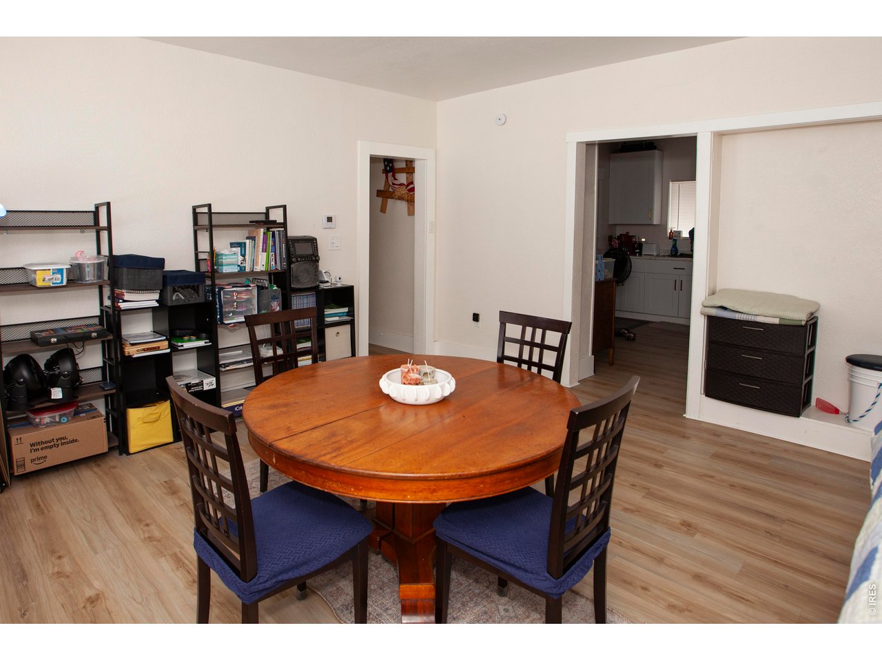 212 Denver Street Sterling, CO 80751 - Photo 5 of 30 a dining room with furniture and wooden floor