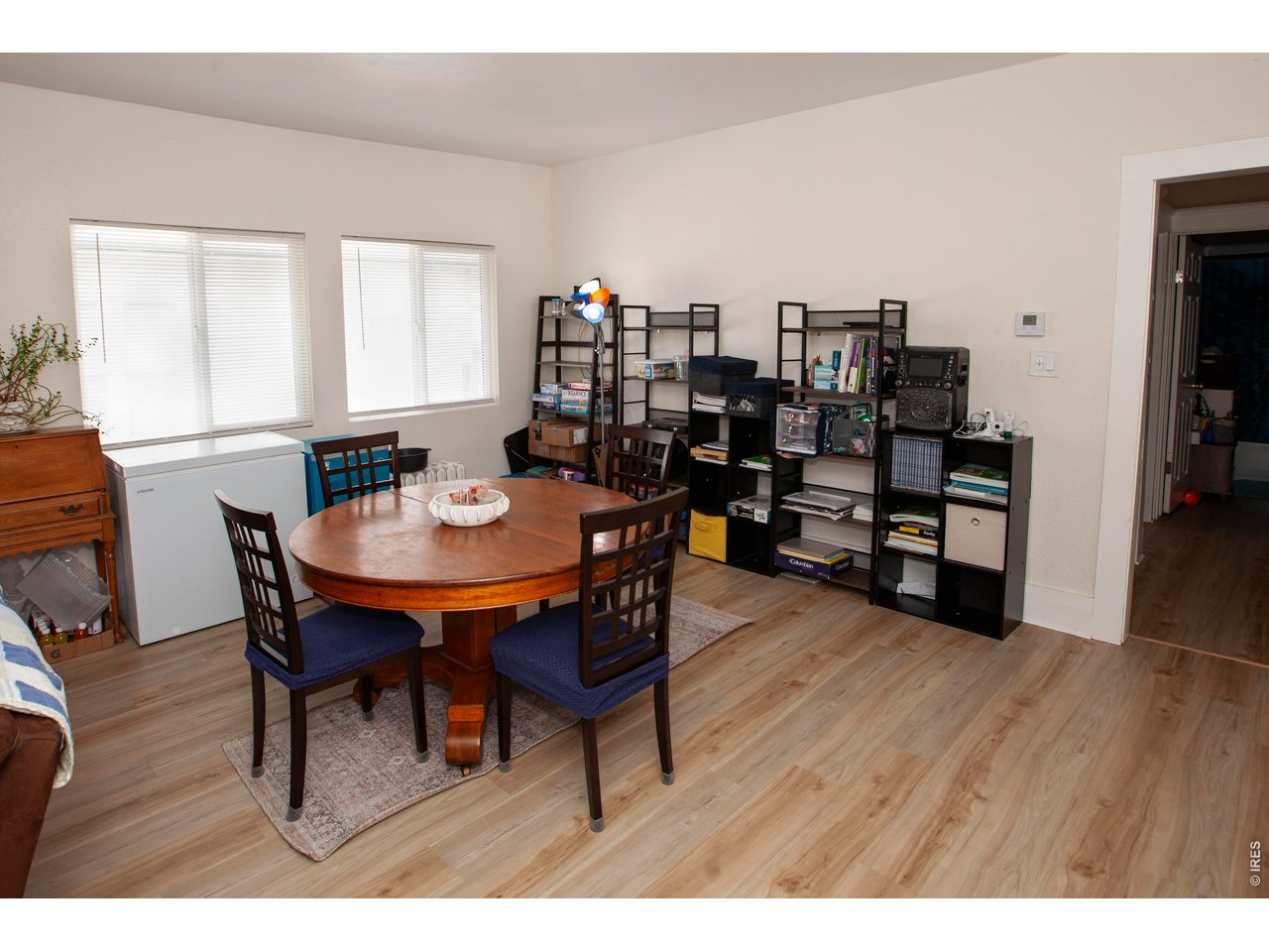 212 Denver Street Sterling, CO 80751 - Photo 6 of 30 a view of a dining room with furniture and wooden floor