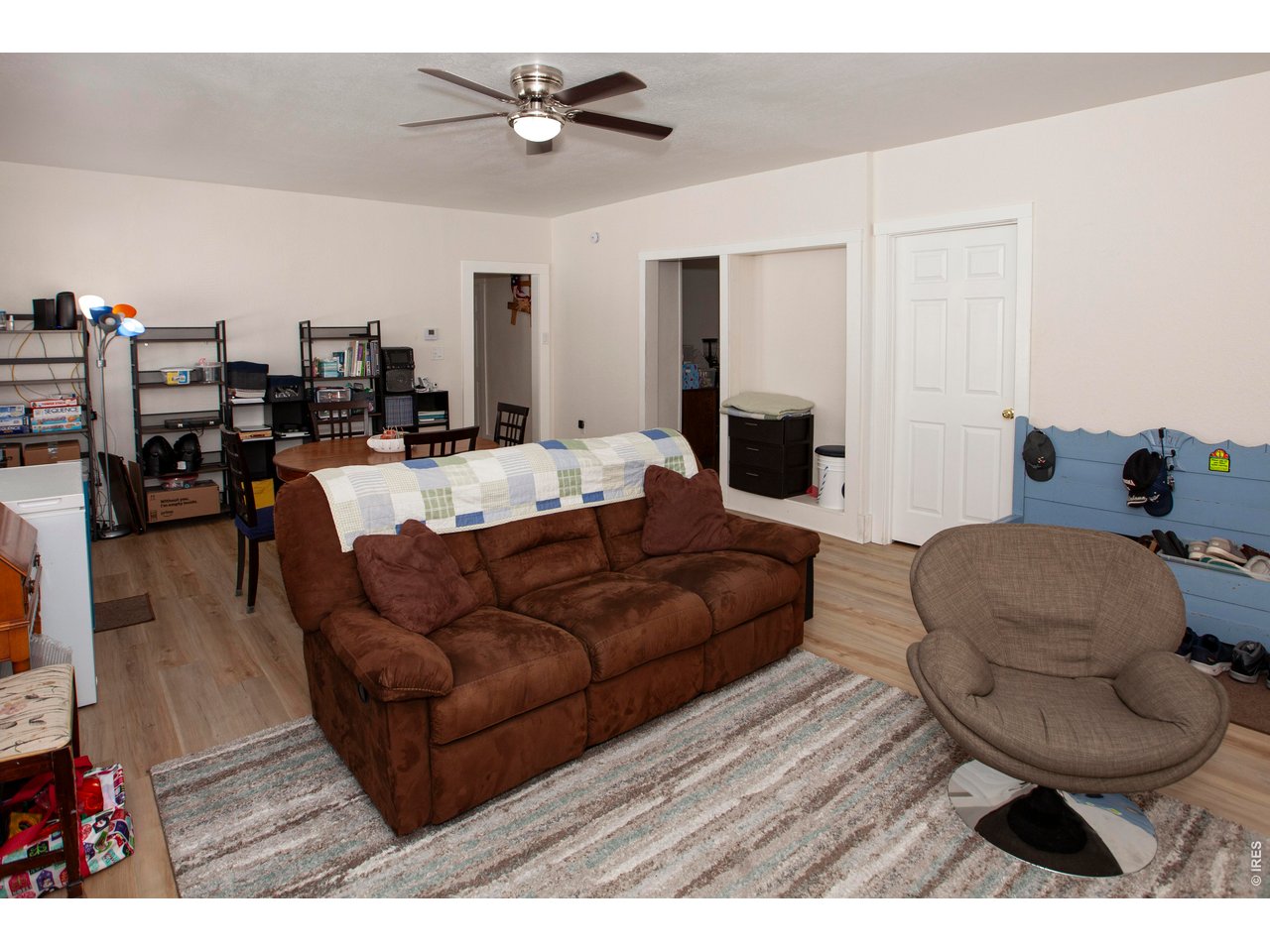 212 Denver Street Sterling, CO 80751 - Photo 8 of 30 a living room with furniture and a wooden floor