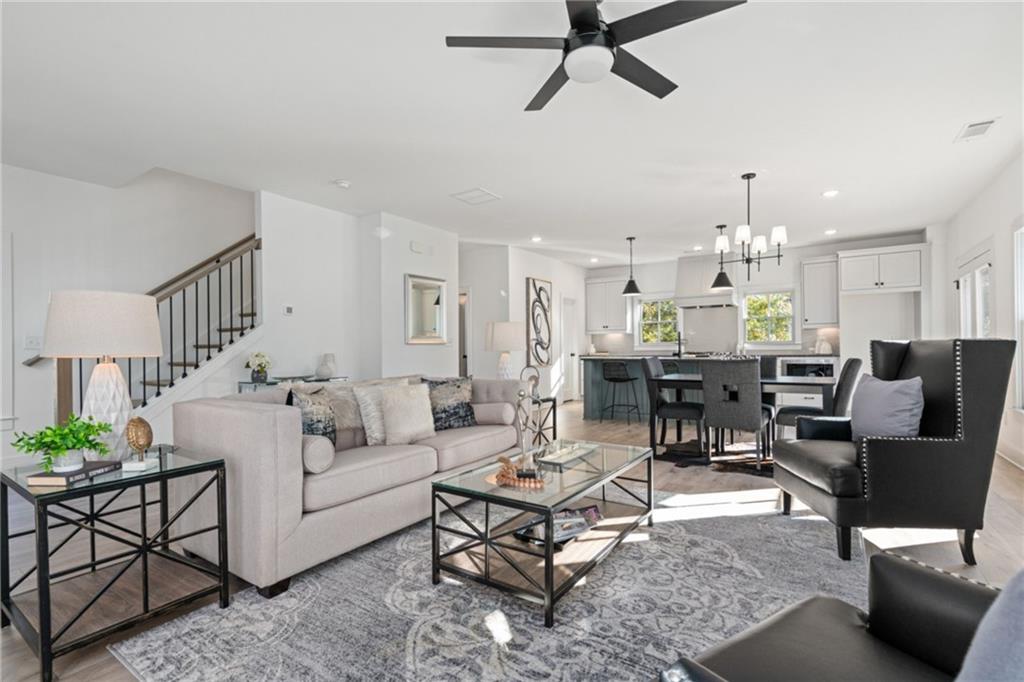 3312 Springhaven Avenue Hapeville, GA 30354 - Photo 14 of 54 a living room with furniture and a chandelier