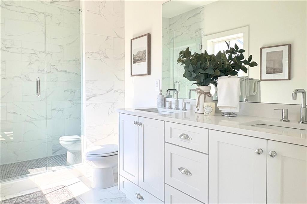 3312 Springhaven Avenue Hapeville, GA 30354 - Photo 20 of 54 a bathroom with a granite countertop toilet sink and mirror