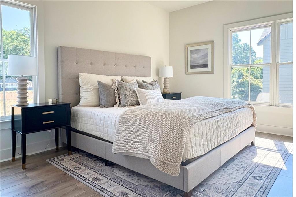 3312 Springhaven Avenue Hapeville, GA 30354 - Photo 22 of 54 a large bed sitting in a bedroom next to a window