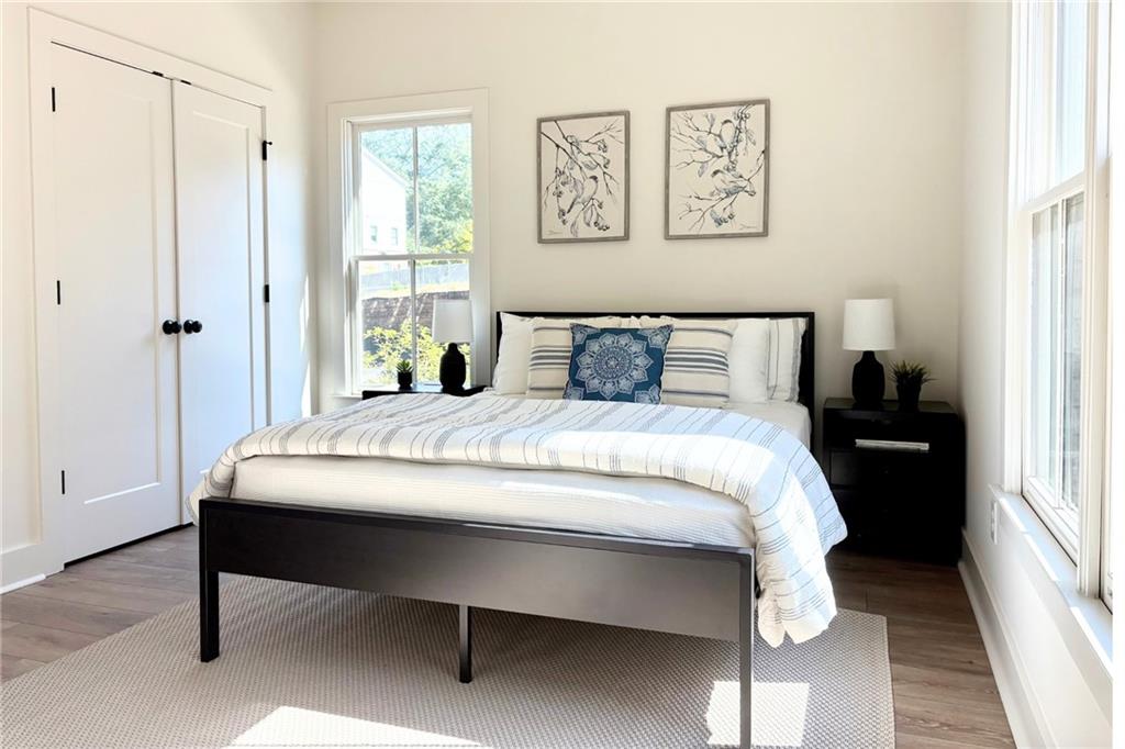 3312 Springhaven Avenue Hapeville, GA 30354 - Photo 24 of 54 a bed sitting in a bedroom next to a window