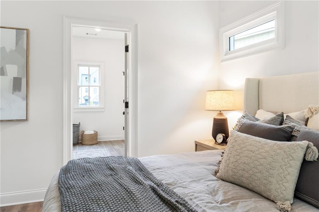 3312 Springhaven Avenue Hapeville, GA 30354 - Photo 28 of 54 a bedroom with a bed and wooden floor