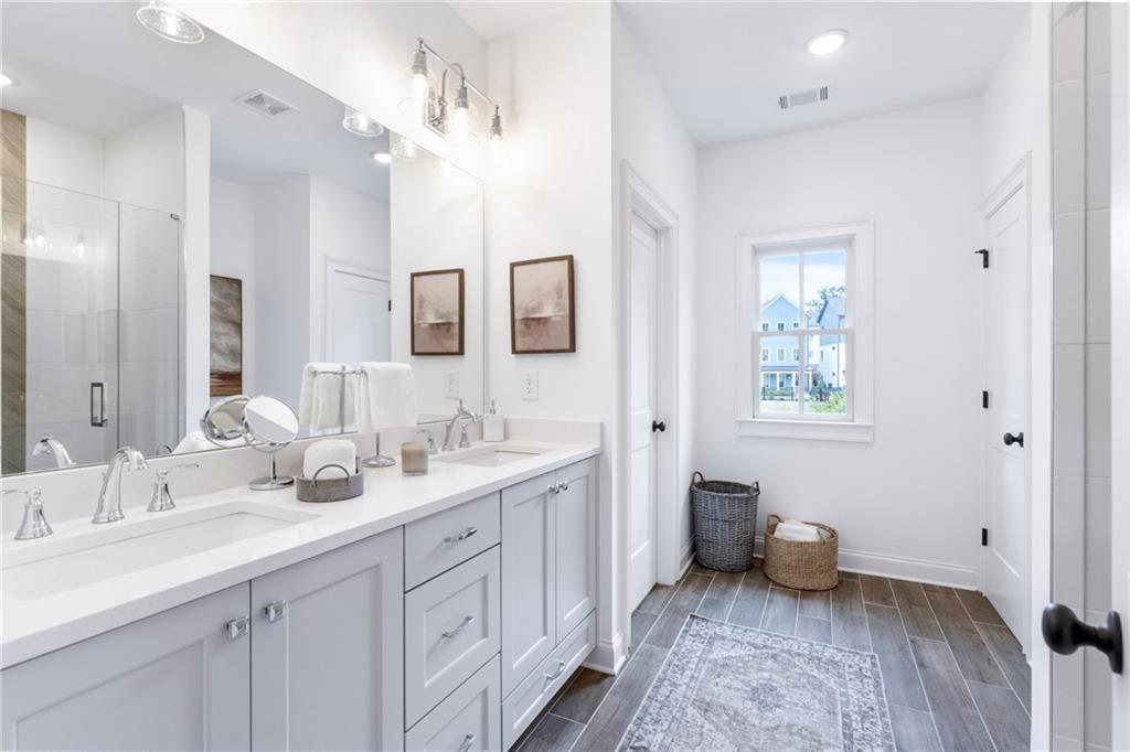 3312 Springhaven Avenue Hapeville, GA 30354 - Photo 29 of 54 a spacious bathroom with a double vanity sink mirror and