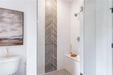 a bathroom with double sink and a mirror