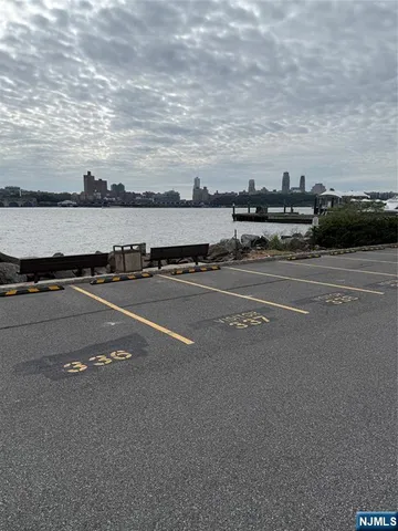 a view of a city street with and car parked