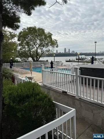 a view of balcony and yard