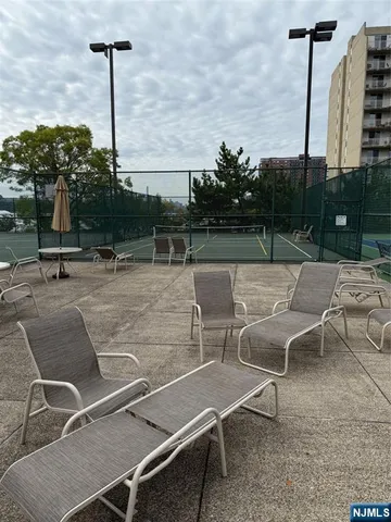 a patio with table and chairs