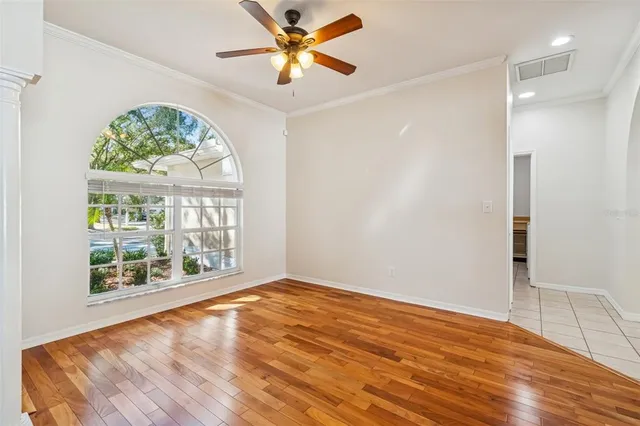 a kitchen with refrigerator and cabinets