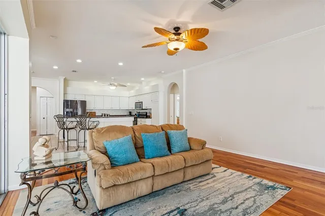 a spacious bathroom with a granite countertop tub and a large window