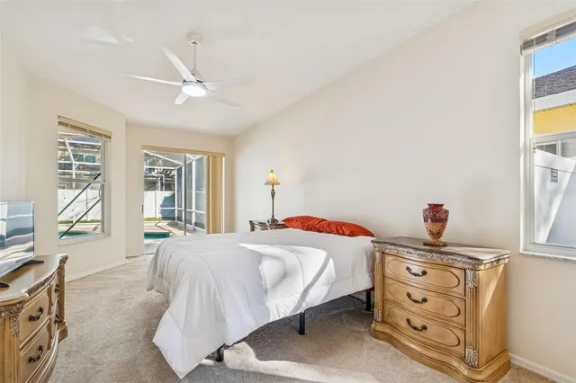 a spacious bathroom with a tub a double vanity sink and a mirror