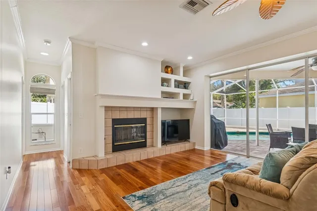 a living room with furniture and a fireplace