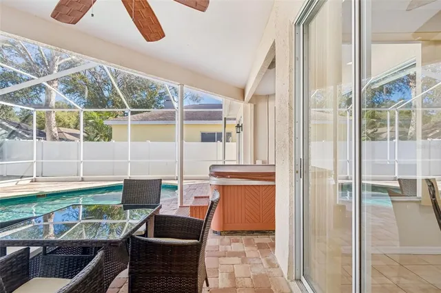a view of a patio with table and chairs