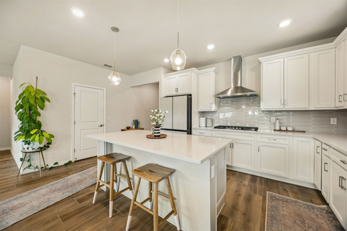 368 Muhly Grass Street Yulee, FL 32097 - Photo 12 of 60 a kitchen with stainless steel appliances white cabinets a sink stove and refrigerator