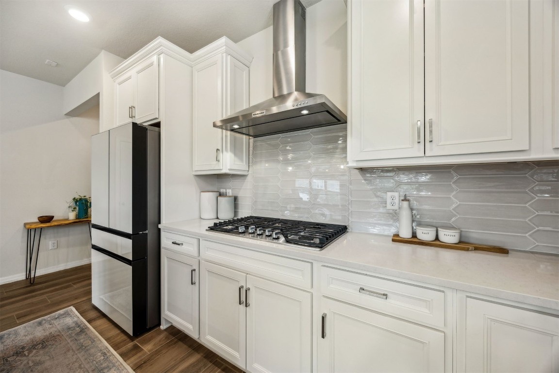 368 Muhly Grass Street Yulee, FL 32097 - Photo 14 of 60 a kitchen with stainless steel appliances a stove a refrigerator a sink and cabinets