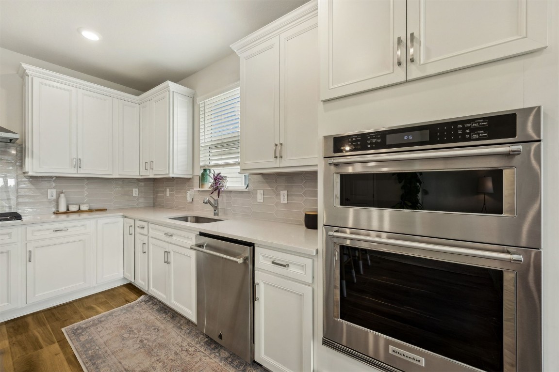 368 Muhly Grass Street Yulee, FL 32097 - Photo 18 of 60 a kitchen with cabinets stainless steel appliances and a sink