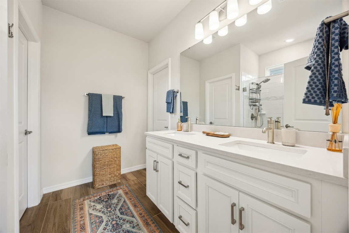 368 Muhly Grass Street Yulee, FL 32097 - Photo 22 of 60 a spacious bathroom with a double vanity sink and a mirror