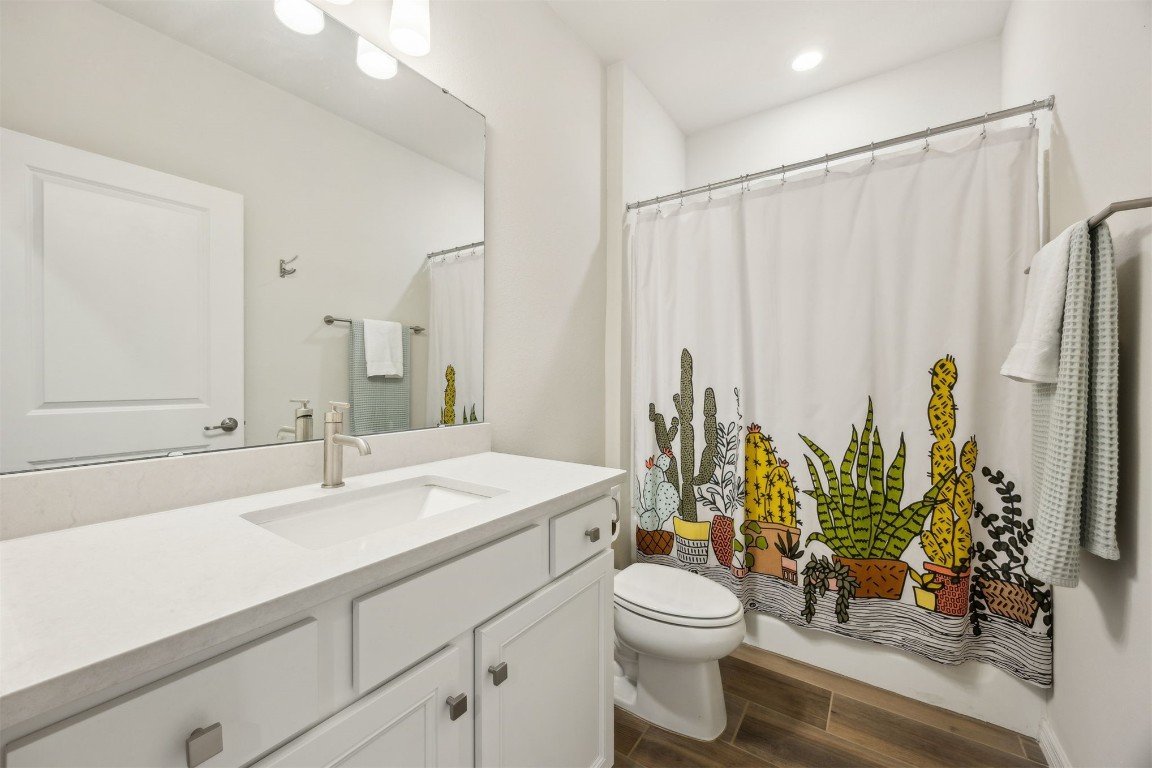 368 Muhly Grass Street Yulee, FL 32097 - Photo 27 of 60 a bathroom with a sink a toilet and a mirror