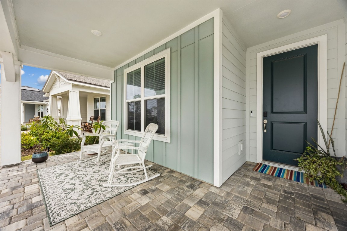 368 Muhly Grass Street Yulee, FL 32097 - Photo 3 of 60 a view of a house with backyard sitting area and garden