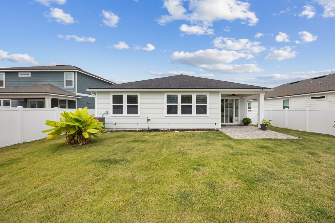 368 Muhly Grass Street Yulee, FL 32097 - Photo 31 of 60 a view of a house with a backyard