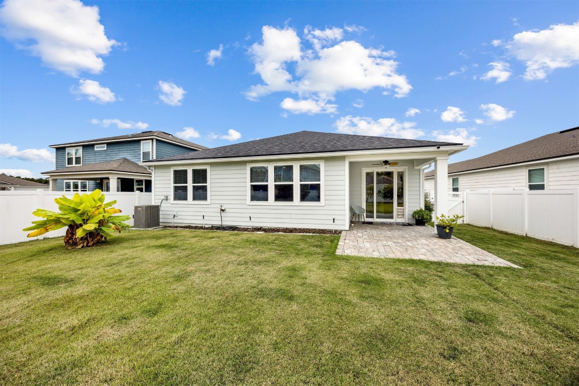 368 Muhly Grass Street Yulee, FL 32097 - Photo 32 of 60 a view of a house with a patio
