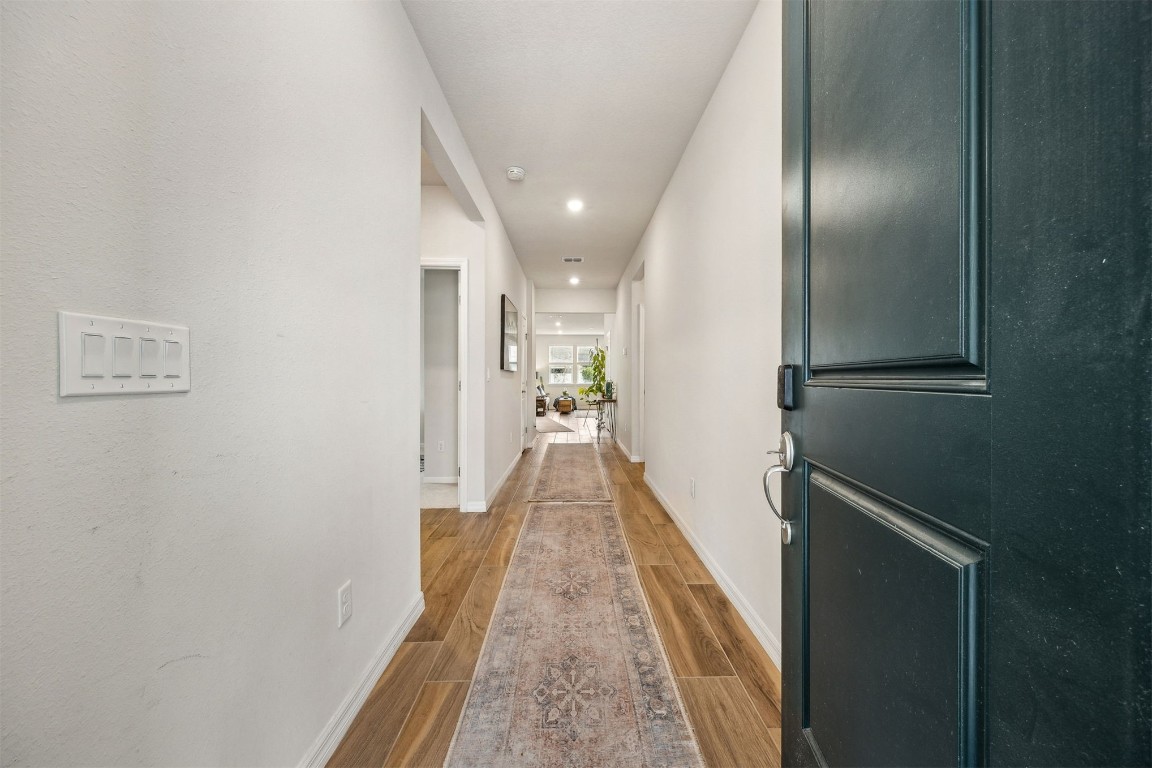 368 Muhly Grass Street Yulee, FL 32097 - Photo 5 of 60 a view of hallway with wooden floor