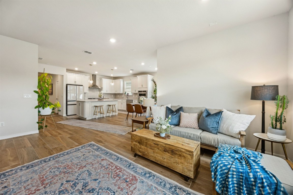 368 Muhly Grass Street Yulee, FL 32097 - Photo 8 of 60 a living room with furniture and a table