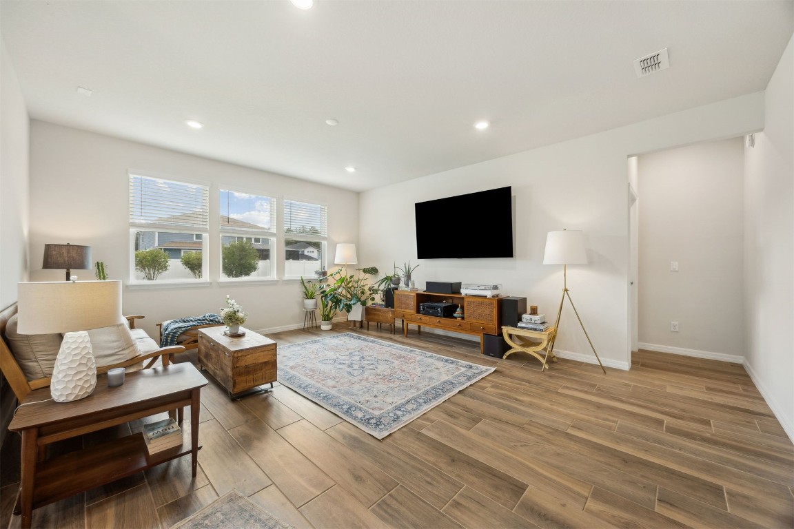 368 Muhly Grass Street Yulee, FL 32097 - Photo 9 of 60 a living room with furniture and a flat screen tv