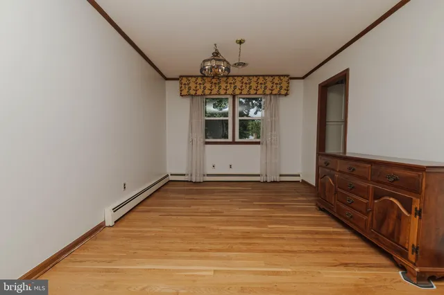 a kitchen with stainless steel appliances granite countertop a washer and dryer