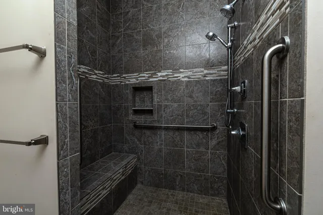 a bathroom with a toilet a sink and a window