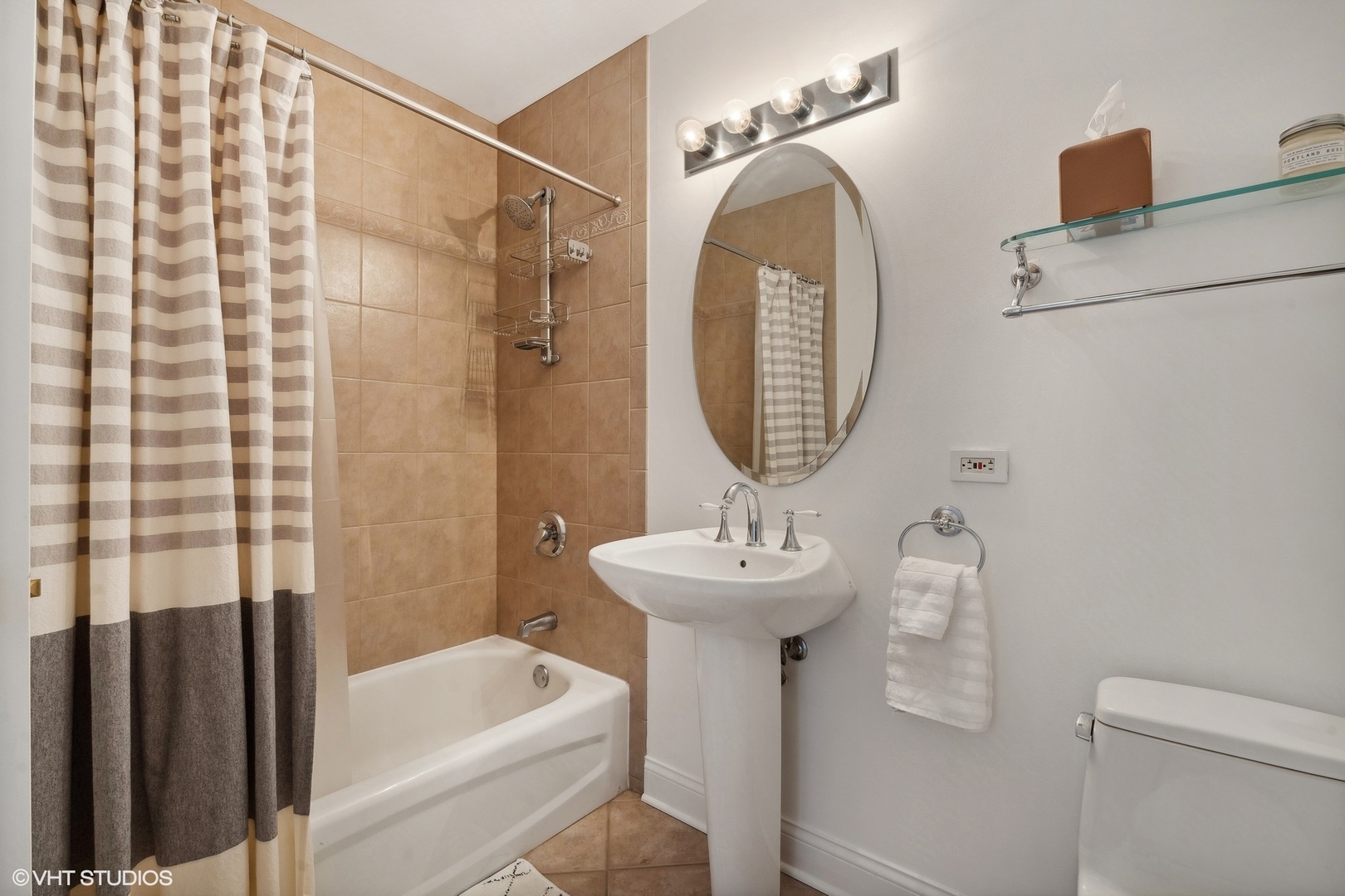 910 West Madison Street, Unit 608 Chicago, IL 60607 - Photo 13 of 15 a bathroom with a sink a toilet and shower
