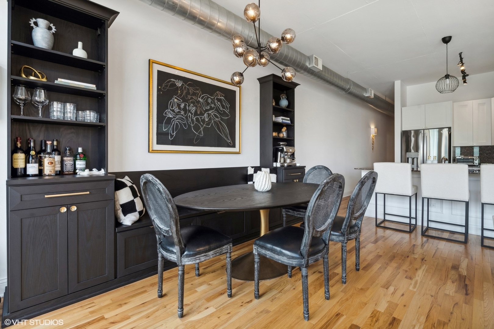 910 West Madison Street, Unit 608 Chicago, IL 60607 - Photo 4 of 15 a view of a dining room with furniture and wooden floor
