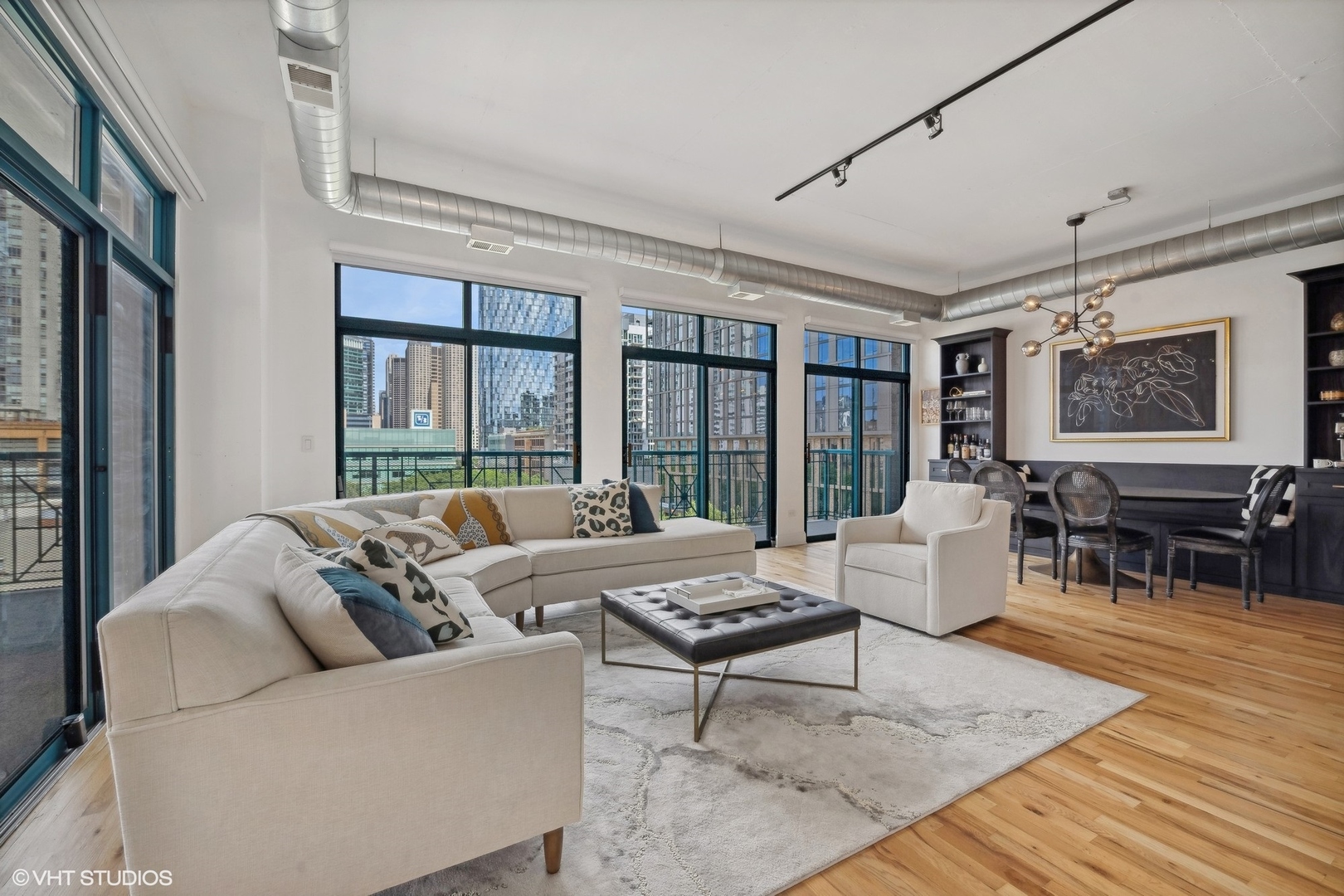910 West Madison Street, Unit 608 Chicago, IL 60607 - Photo 7 of 15 a living room with furniture and large windows