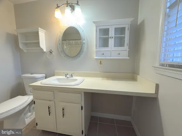 a bathroom with a shower and a toilet