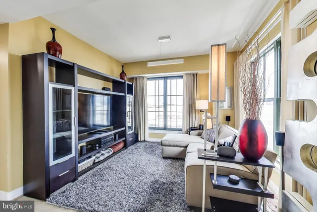 a bedroom with a bed window and furniture