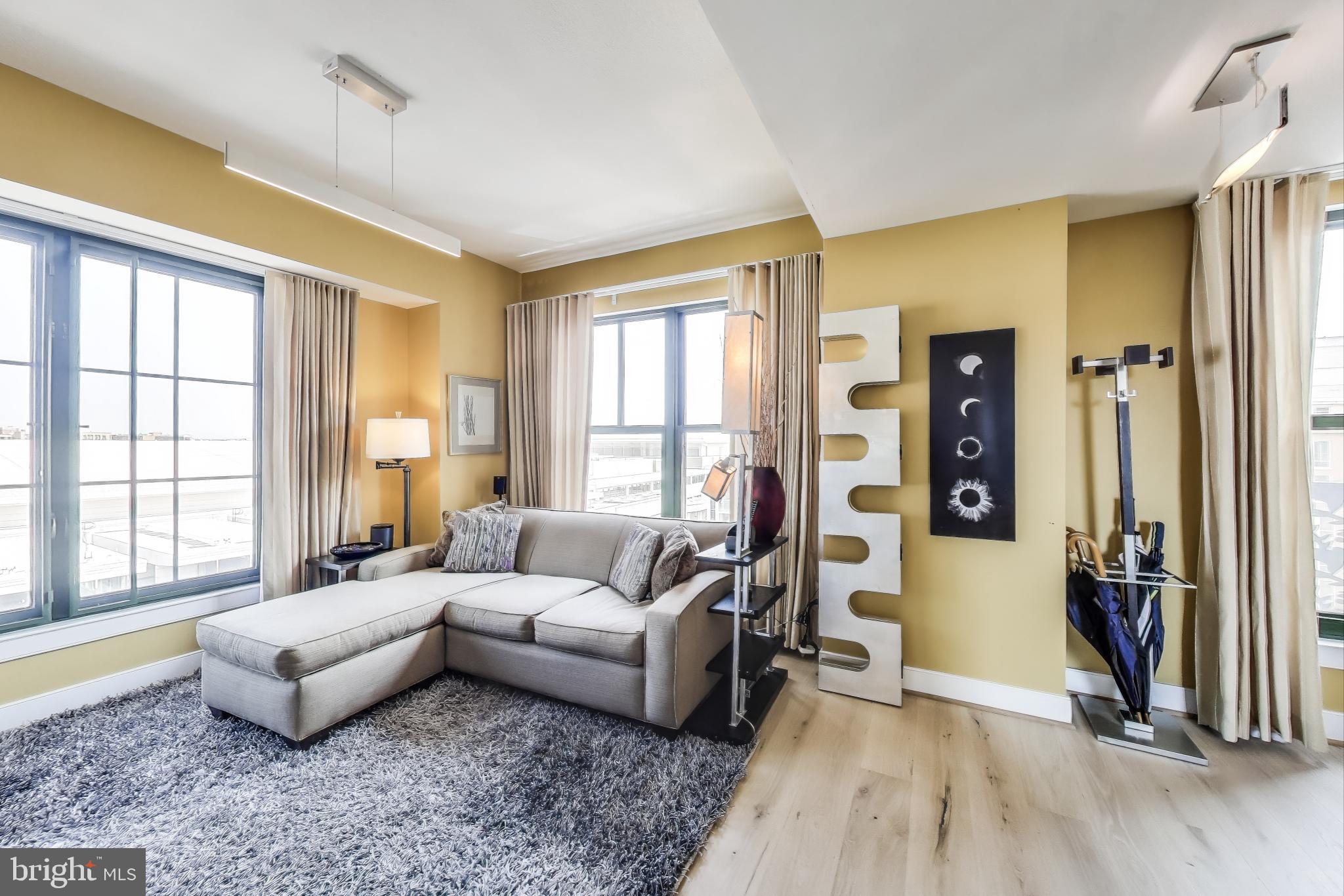 910 M Street Northwest, Unit 1022 Washington, DC 20001 - Photo 17 of 64 a living room with furniture and a window