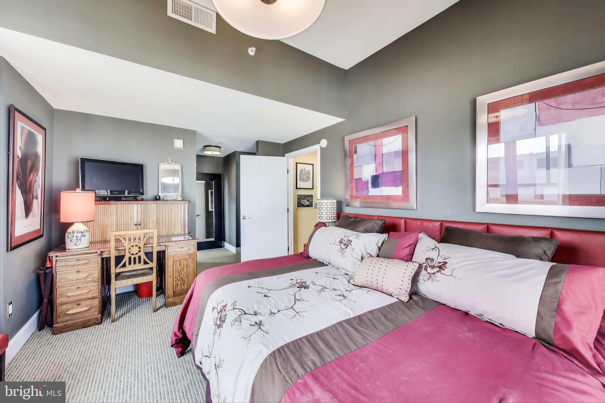 910 M Street Northwest, Unit 1022 Washington, DC 20001 - Photo 21 of 64 a bedroom with a bed window and furniture