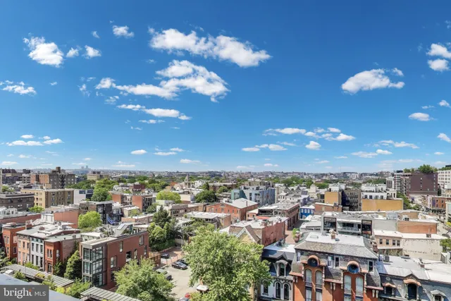 a front view of a building with a garden