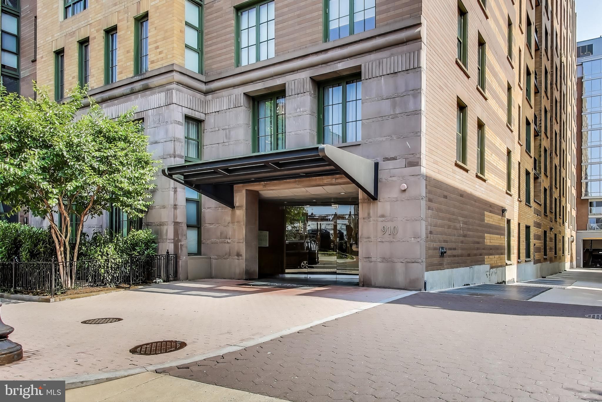 910 M Street Northwest, Unit 1022 Washington, DC 20001 - Photo 36 of 64 a front view of a building with a garden