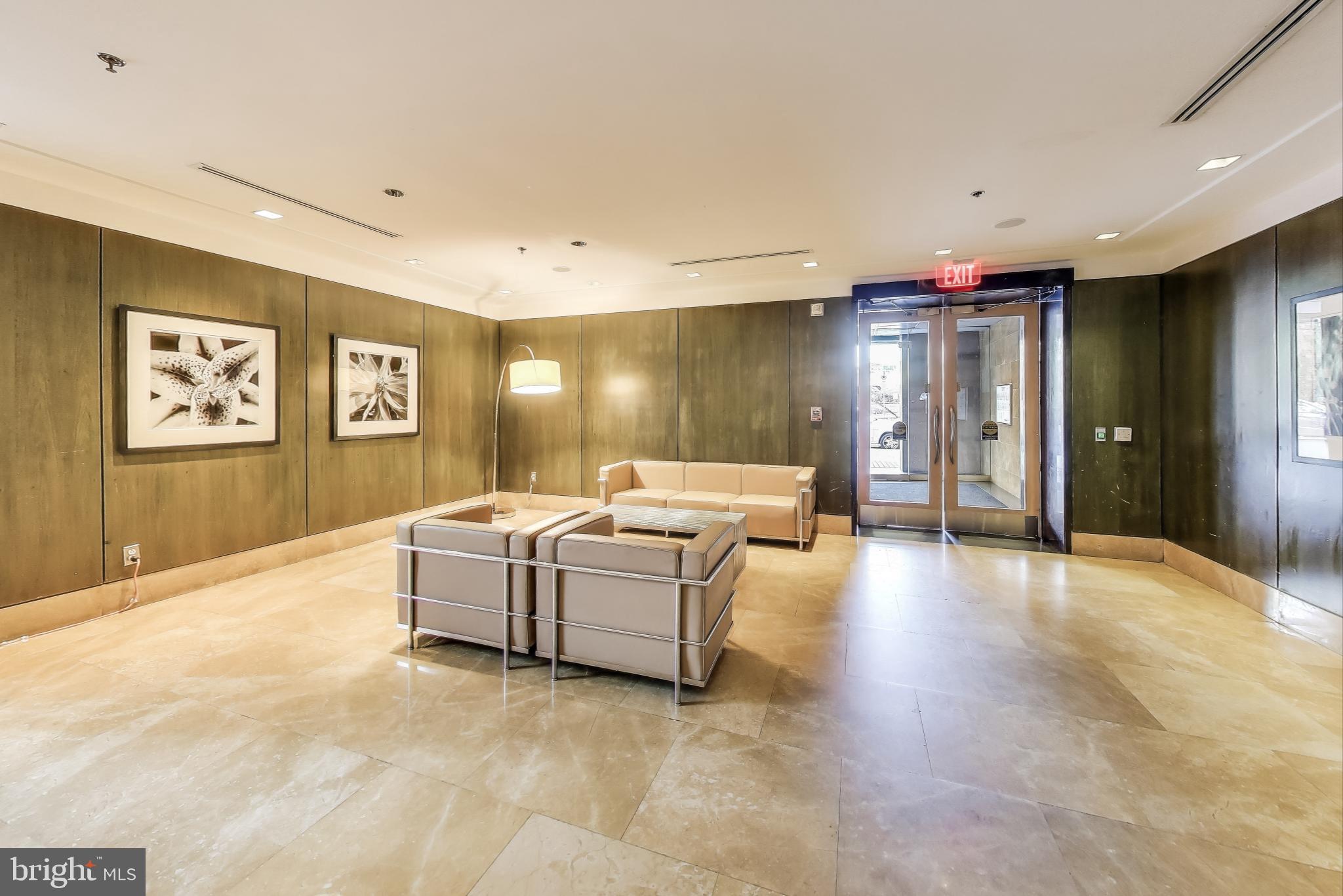 910 M Street Northwest, Unit 1022 Washington, DC 20001 - Photo 38 of 64 a living room with furniture and a large window