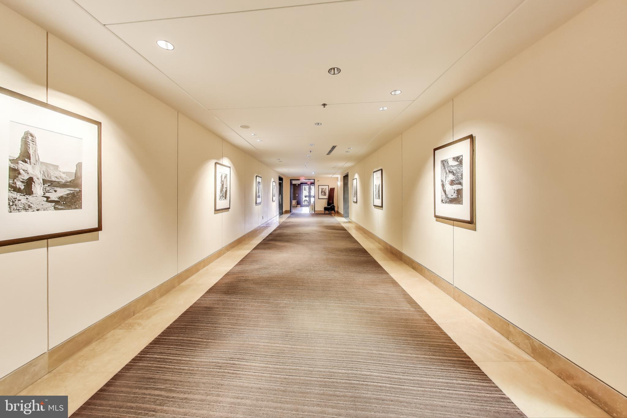 910 M Street Northwest, Unit 1022 Washington, DC 20001 - Photo 39 of 64 a view of a hallway with wooden floor