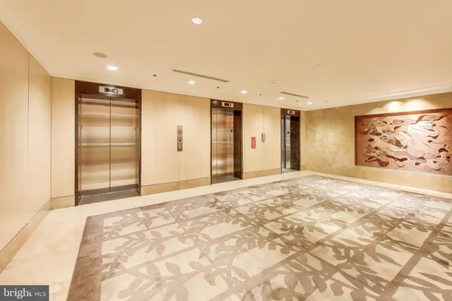 a view of roof deck with dining table and chairs with wooden floor