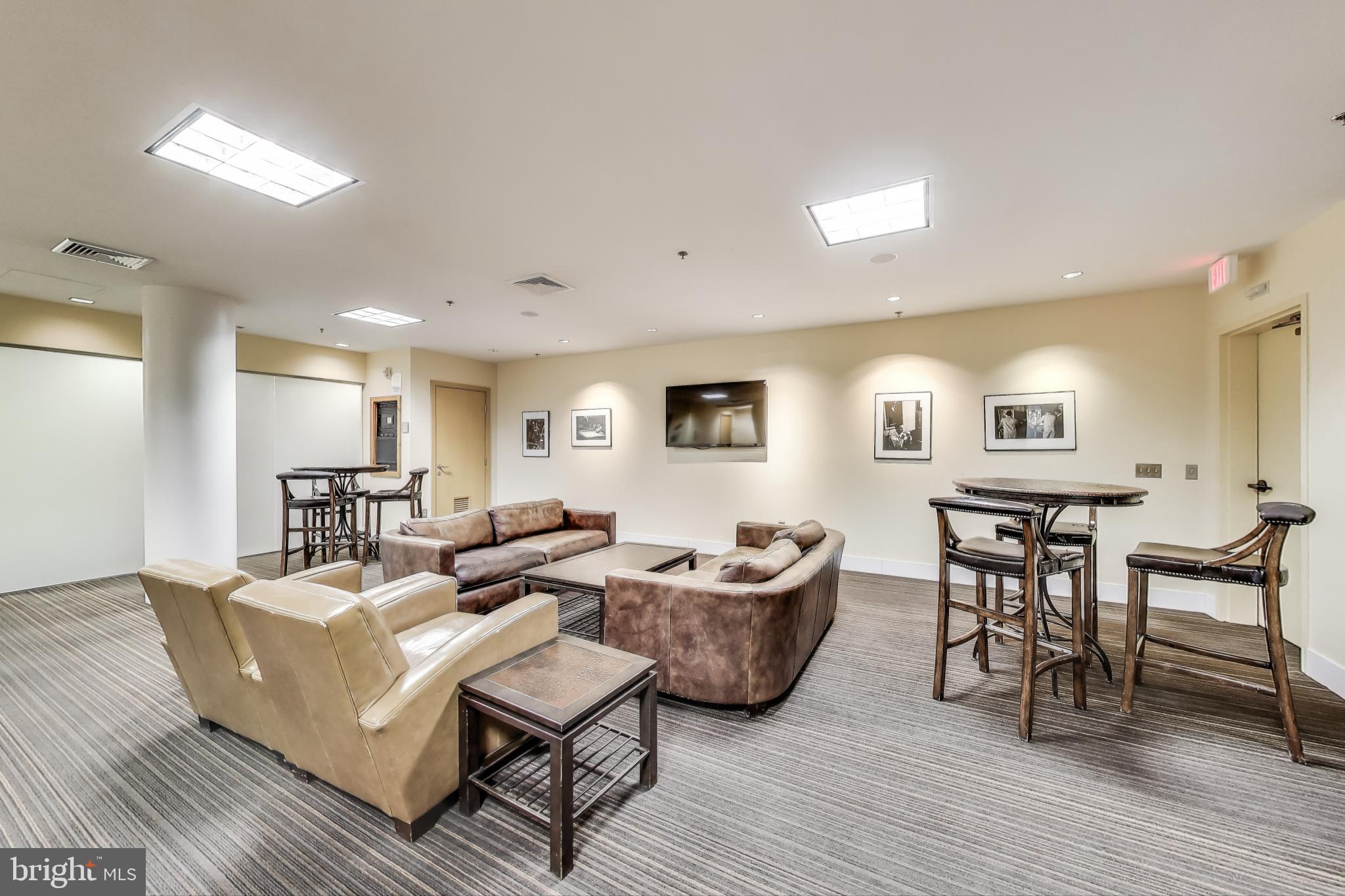 910 M Street Northwest, Unit 1022 Washington, DC 20001 - Photo 41 of 64 a living room with furniture and wooden floor