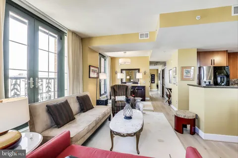 a view of a dining room with furniture and window